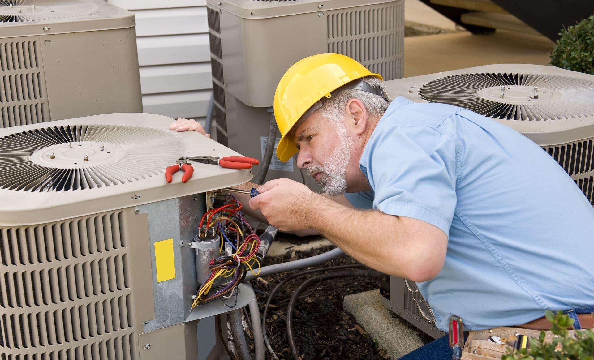 HVAC technician performing heating and cooling repairs in Sarasota FL
