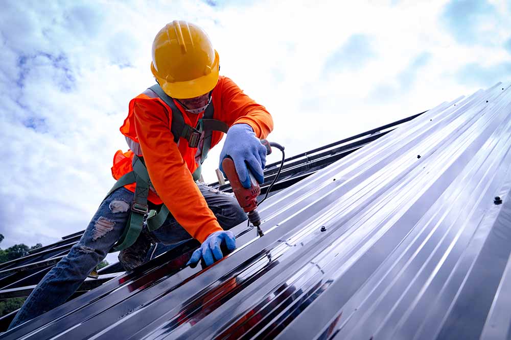 Roofer working on roof structure